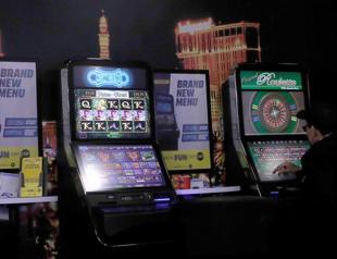 Britain cuts top stake on gambling machines on addiction fears