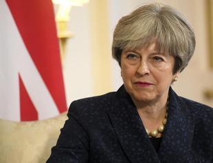 Britain’s May agrees with France, Germany on upholding Iran nuclear deal