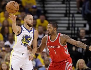 Curry silences critics as Warriors rout Rockets