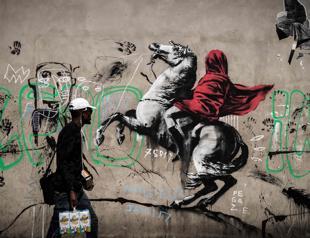 Banksy needles France with migrant mural blitz in Paris