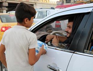 Child beggars fill Mosul streets a year on from ISIL