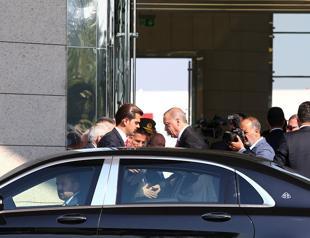 Sworn in with new powers, Erdoğan leaves on first trip