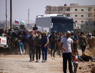 Syria rebels begin evacuating Daraa