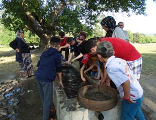 Locals ‘wash fish’ to help them survive ‘pitch black water’ in Turkey’s west