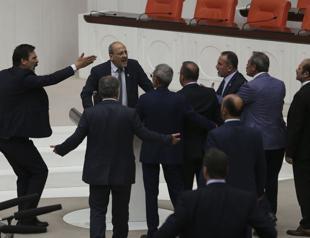 Four anti-terror articles passed in parliament amid brawl