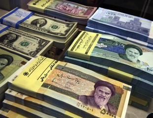 Iran woos local investors as US sanctions loom, currency falls