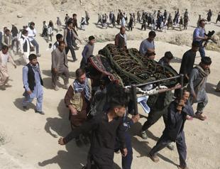 Gunmen besiege Kabul compound as Afghans mourn Shite dead