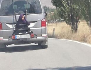 Driver detained for carrying daughter tied to back of car in central Turkey