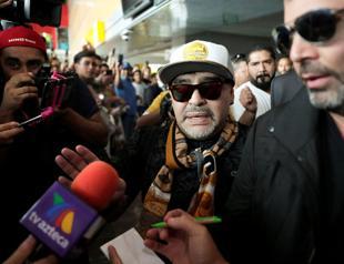 Dozens of fans laud Maradona’s arrival in Mexico