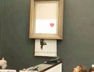 Banksy shocks art world by shredding $1.4 mln work at auction