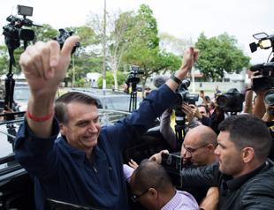 Divided Brazil barrels towards uncertain presidential run-off