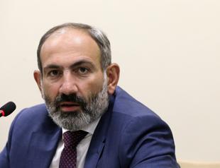 Armenian premier steps down, maneuvering for early election