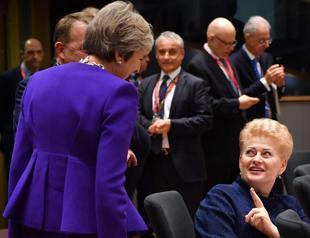 UK PM mulls longer transition as EU demands Brexit progress