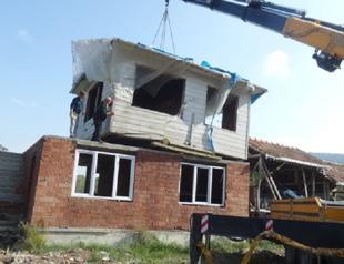 Turkish man moves father’s house on top of own house