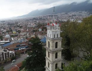 Historical clock tower in Bursa covered with plastic