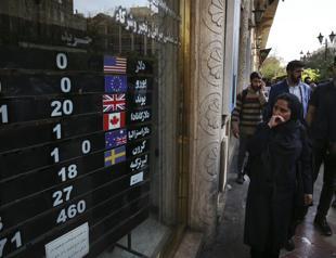 Iran braces for oil sanctions after currency crash, protests