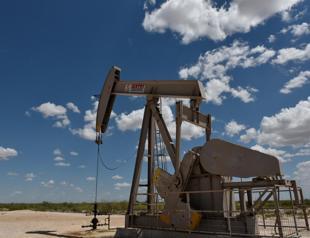 Oil dips as U.S. grants Iran sanctions waivers; Tehran defiant