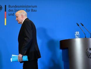 Germany ousts domestic spy chief at centre of govt row