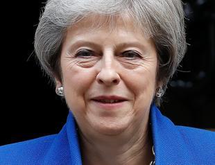 UK’s May takes Brexit deal to cabinet as MPs revolt