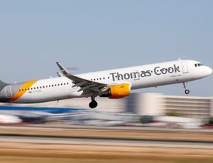 Thomas Cook shares plunge on profit cut, dividend suspended