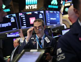 Fed lifts rates for 4th time this year but sees fewer hikes