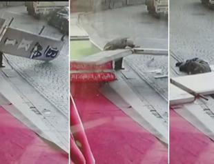 VIDEO: Turkish pensioner dodges death as falling billboard breaks his shoulder