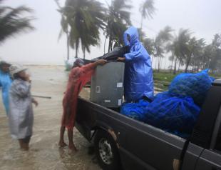 Tropical storm’s rain, surging seas strike Thai beaches