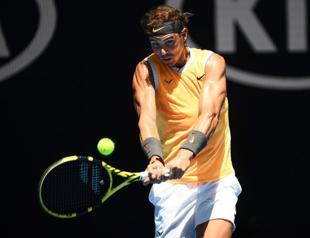 Nadal flies into Open round two as Kerber issues warning