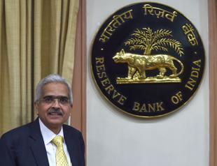 India cuts, Brazil keeps interest rate on hold