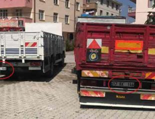 Forged license plate spotted when two trucks parked side by side