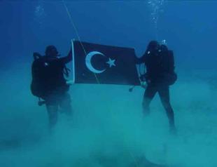 NATO deletes photo of Turkish divers unfurling flag in Greek waters