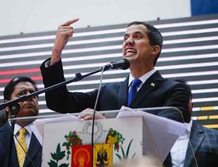 Venezuela’s Maduro blocks Guaido from office as the opposition scoffs