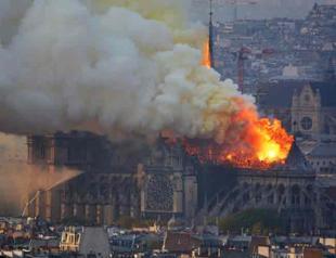 Notre-Dame fire extinguished, Macron vows to rebuild