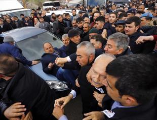 Nine detained over attack on opposition leader at funeral