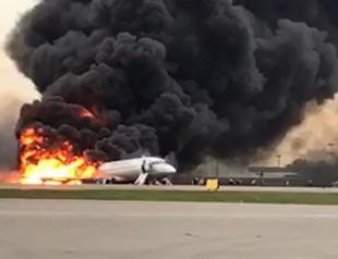 Russian plane lands with fire on board