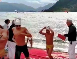 Swimmer who knocked down young racer disqualified