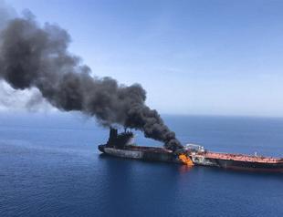 Two tankers catch fire after suspected Gulf of Oman attacks