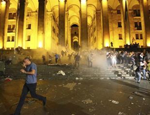 Georgians angry over Russian lawmakers visit try to storm parliament