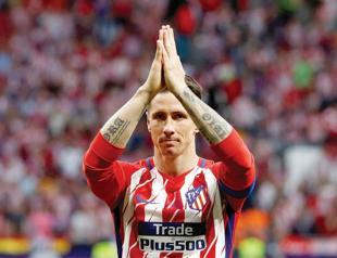 Spain striker Torres retires