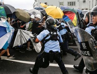 Protests escalate as Hong Kong marks handover to China