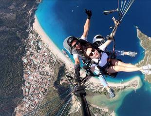 Female paragliders fly tourists over southwest Turkey