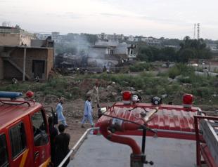 Pakistani army plane crashes into homes, killing at least 18