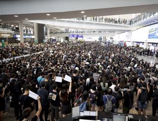 Hong Kong police unveil water cannon trucks after new protests