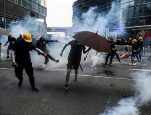 Hong Kong police threaten use of water cannon in latest clashes