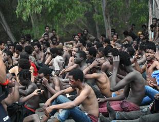 Over 150 migrants storm through Spains enclave fence