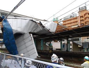 Woman killed as strong typhoon lashes Tokyo area, cutting power and transport