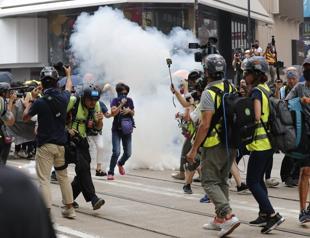 Hong Kong protesters march in defiance ahead of National Day