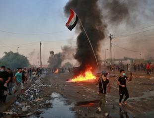 Iraqi PM addresses the nation, urges protesters to go home