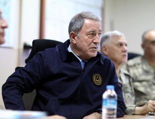 Turkish defense head inspects troops along Syria border