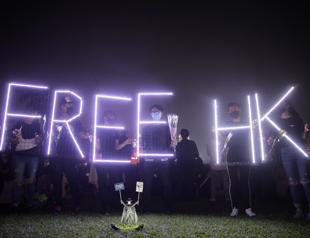 Hong Kong pro-democracy lawmakers detained, student mourned